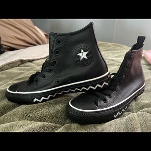 Limited edition black leather converse. Never been worn